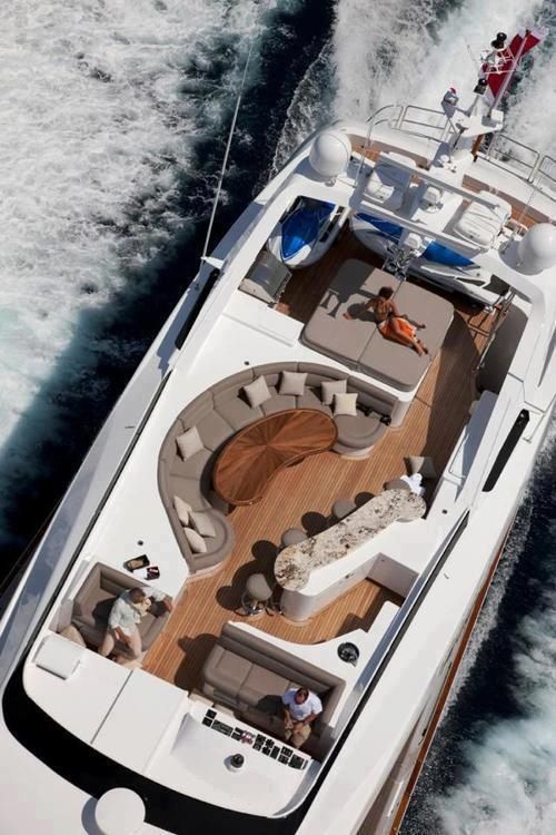 A luxurious yacht with a wooden deck